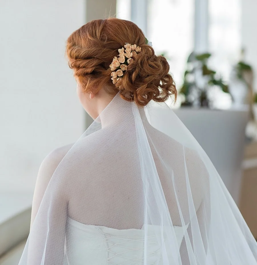 wedding hairstyle with veil underneath for redheads