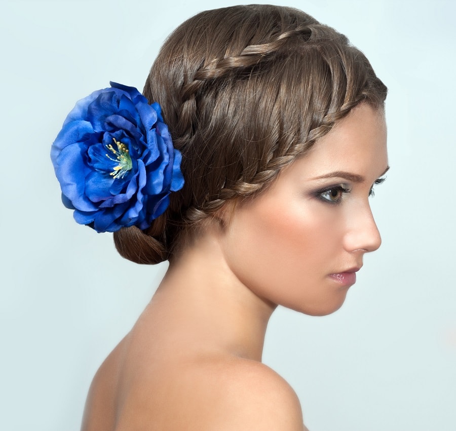 braided updo with flowers for brides