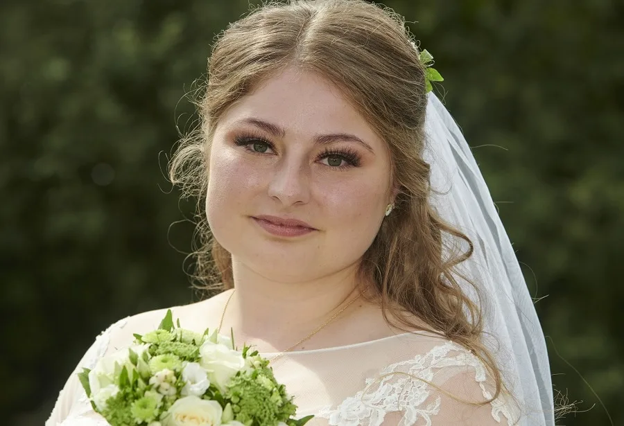 wedding half up hairstyle for fat bride