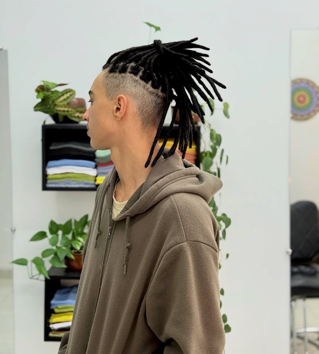 High top knot white boy dreads paired with a clean undercut fade