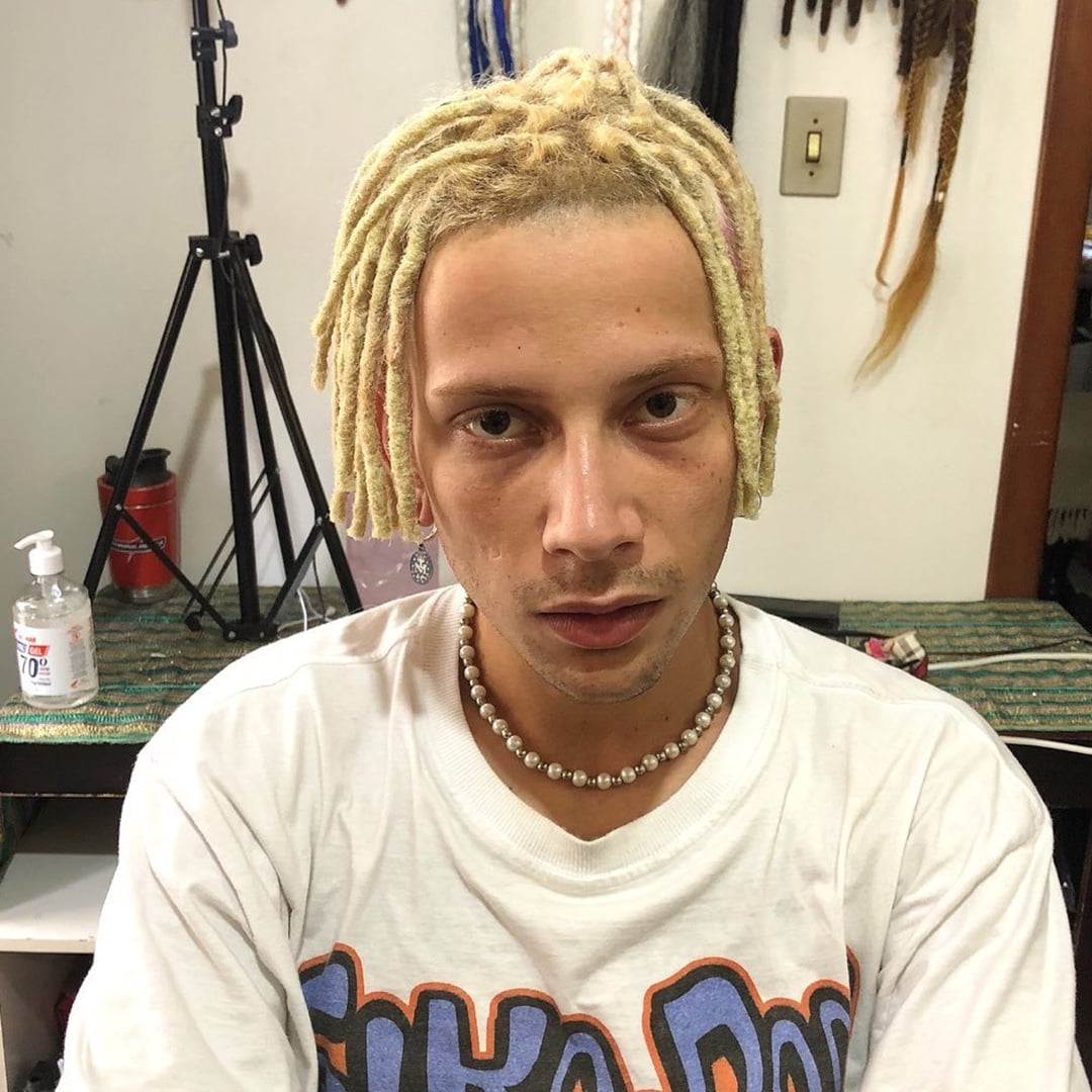 Short blonde dreads for white guy styled with a center part