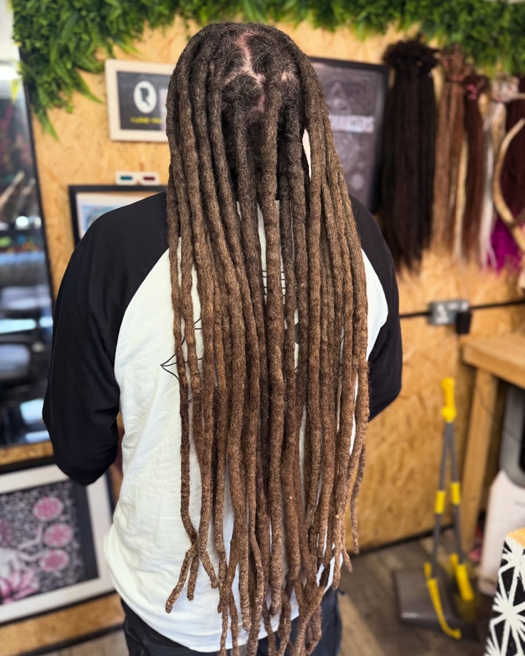 White boy featuring long, natural brown dreadlocks