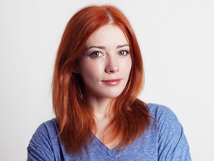 woman over 30 with long red hair