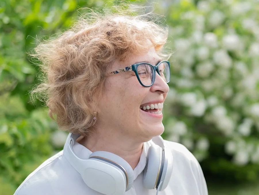 woman over 50 with short permed hair