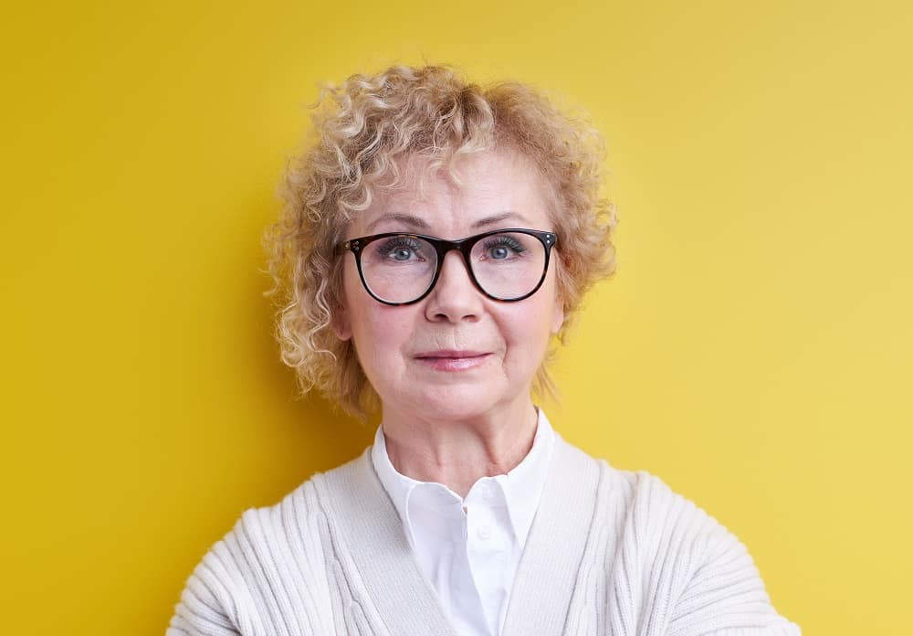 woman over 60 with short fine curls