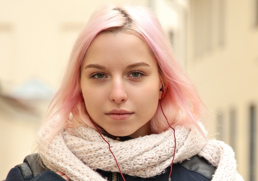 A woman with a big forehead and thin pink hair