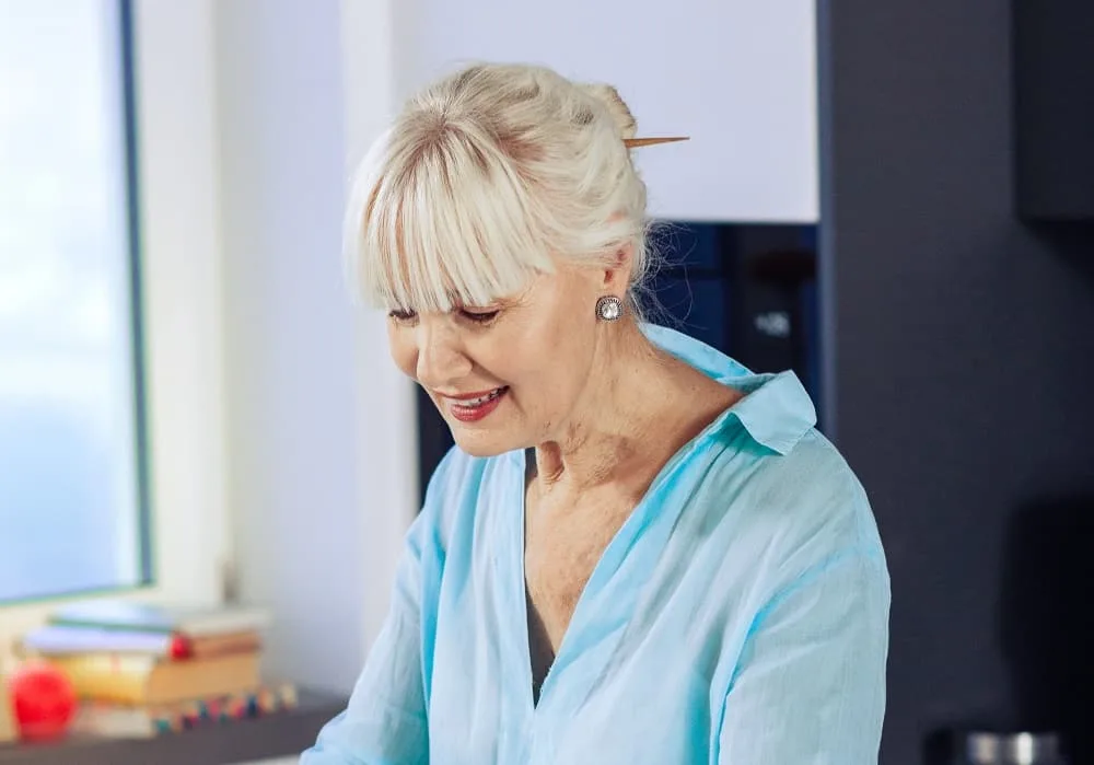 women over 50 long updo with bangs