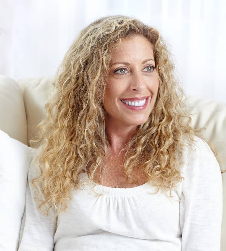 women over 50 with loose curly hair