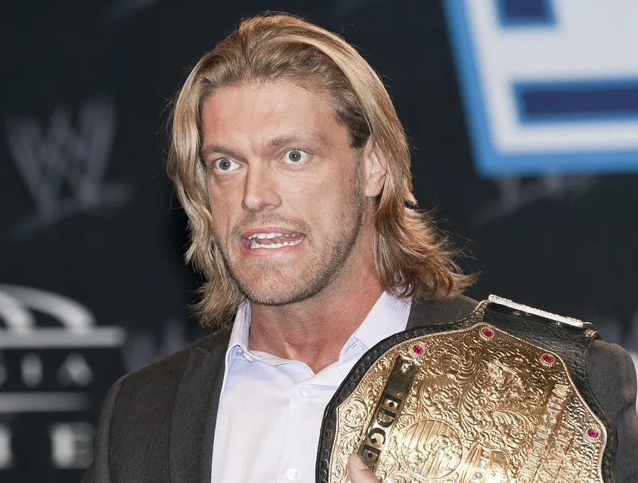wrestler Edge with layered blonde haircut