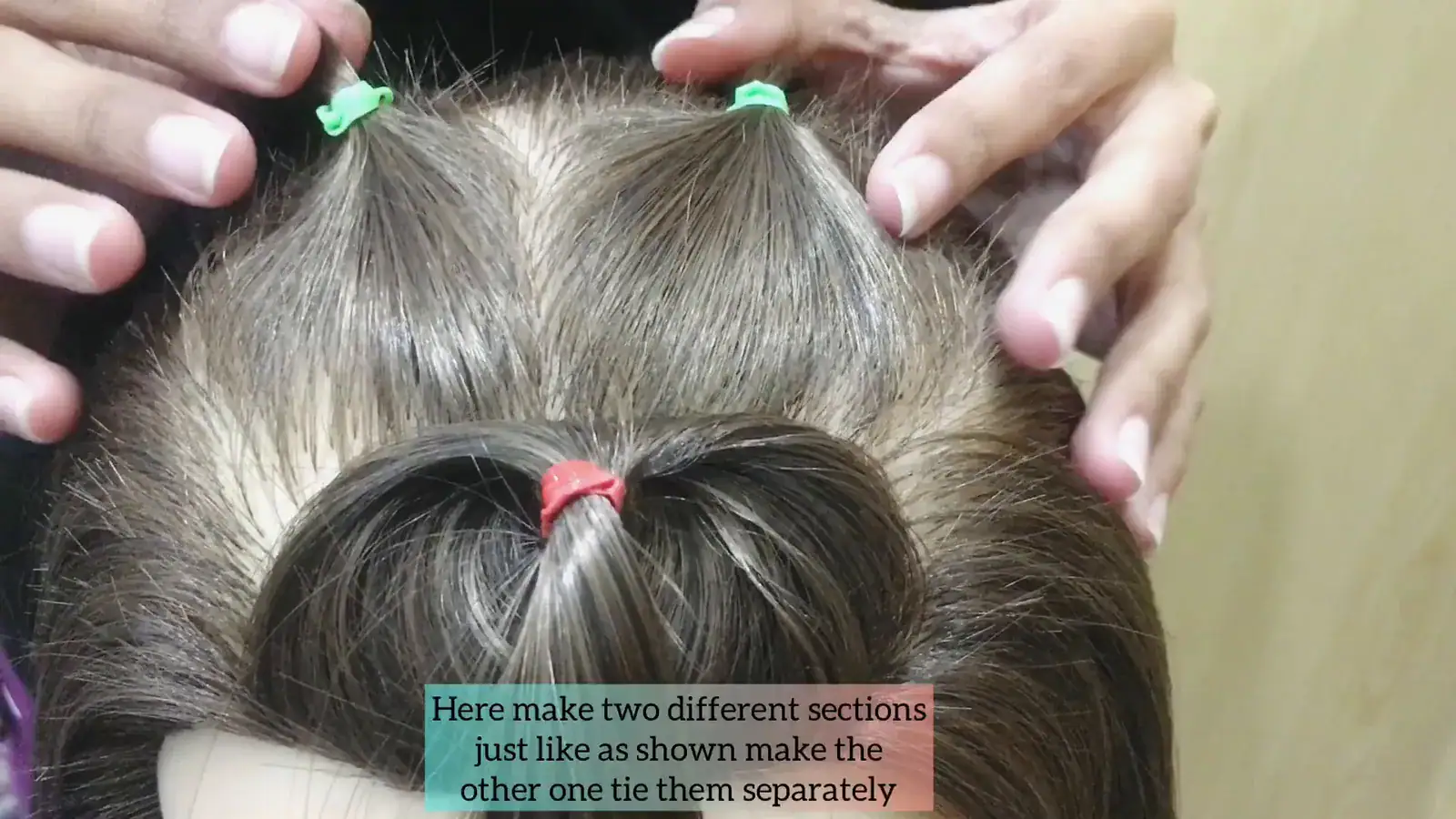 Step 2 showing the second row split into two even ponytails behind the front anchor.