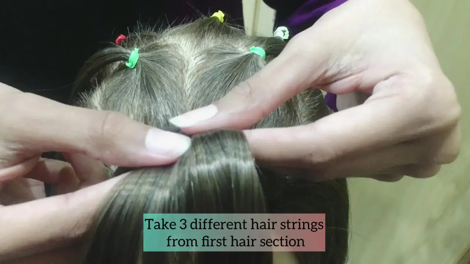 Step 4 dividing the first ponytail into three smaller strands.