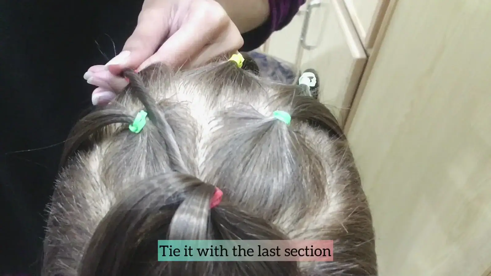 Step 5 twisting one outer strand diagonally toward the back row.