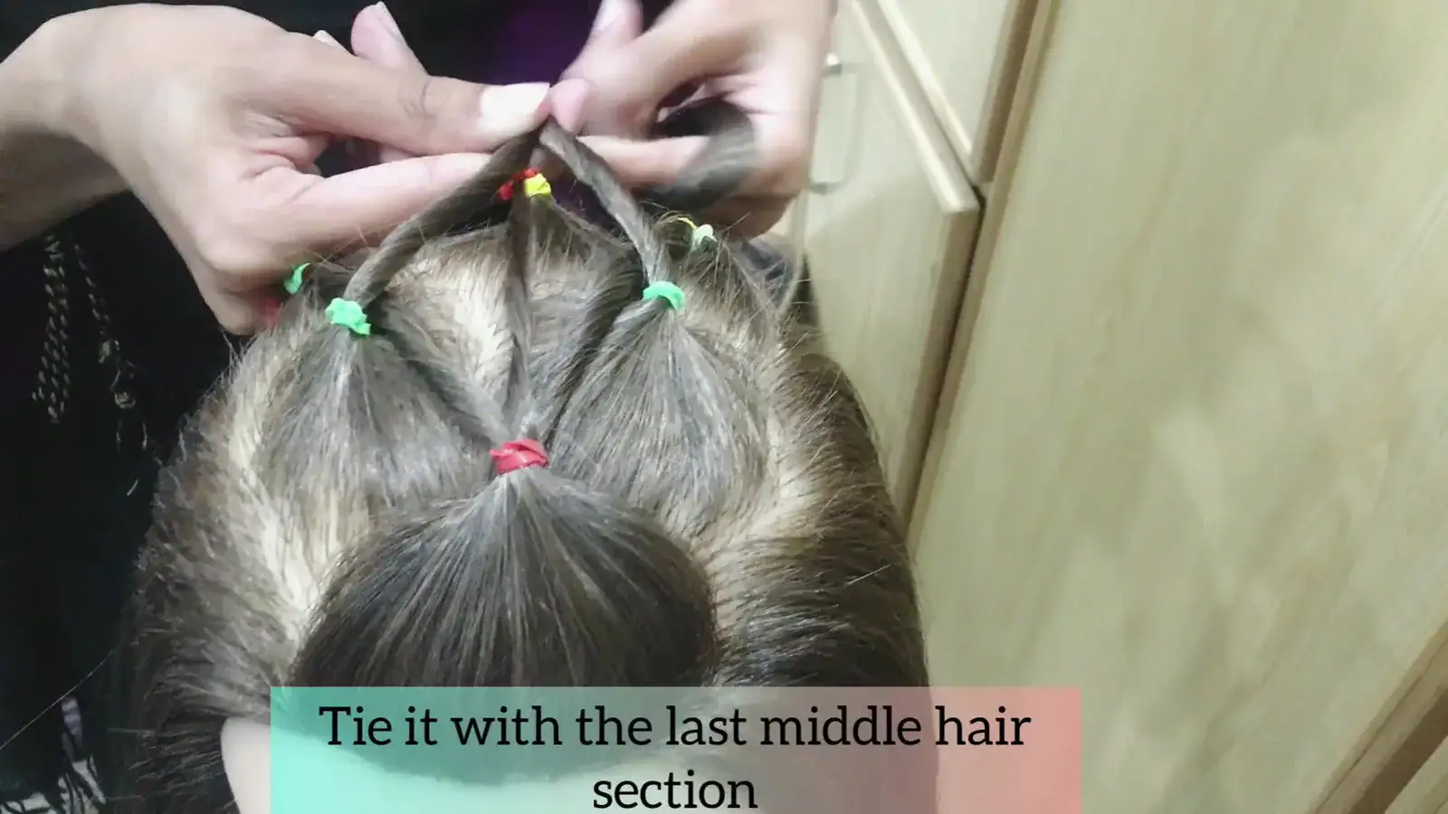 Step 7 bringing the remaining center strand straight back to the final middle ponytail.