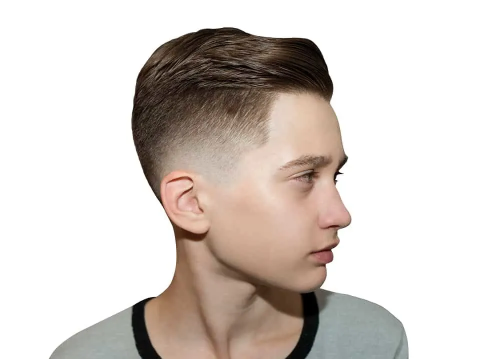 young boy with tapered low fade