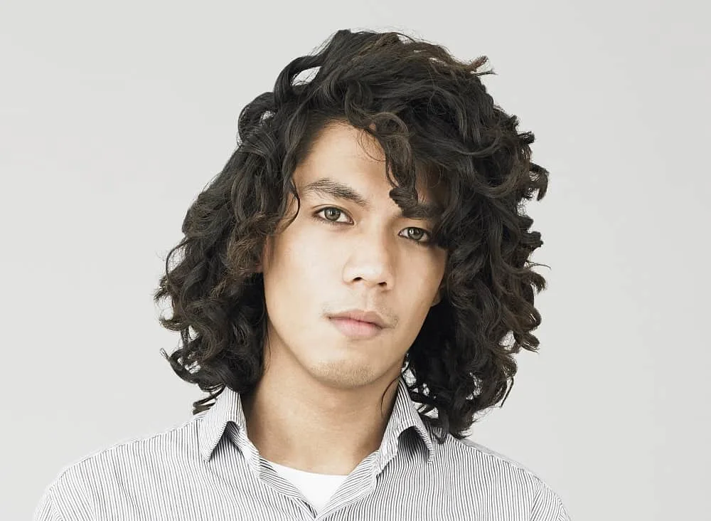 young guy with long thick curls