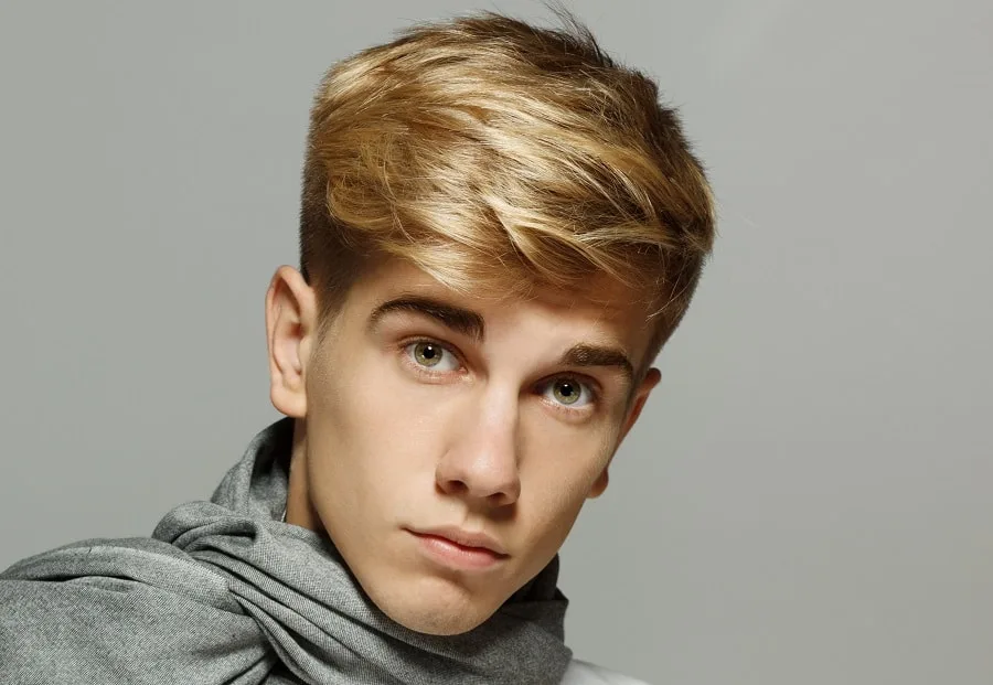 young man with feathered hairstyle