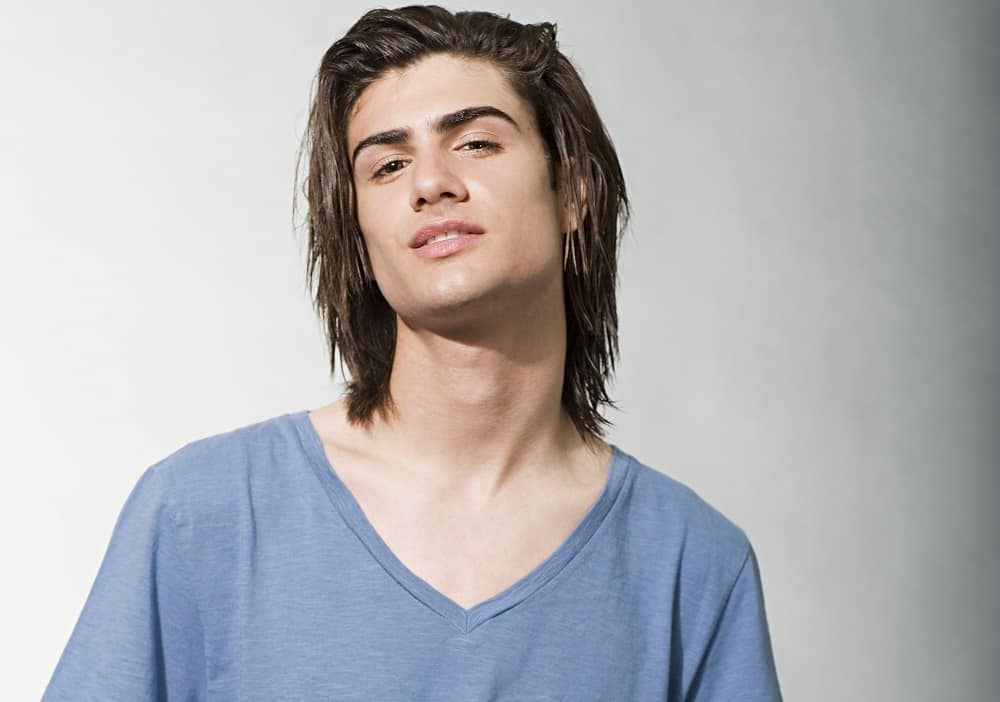 young man with layered long straight hair