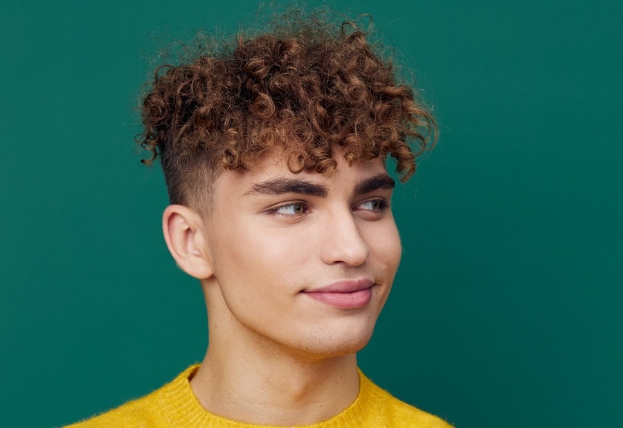 young man with short fluffy curls